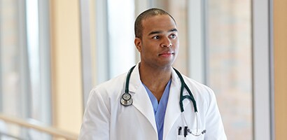 Doctor wearing a 3M Littmann Cardiology III Stethoscope.
